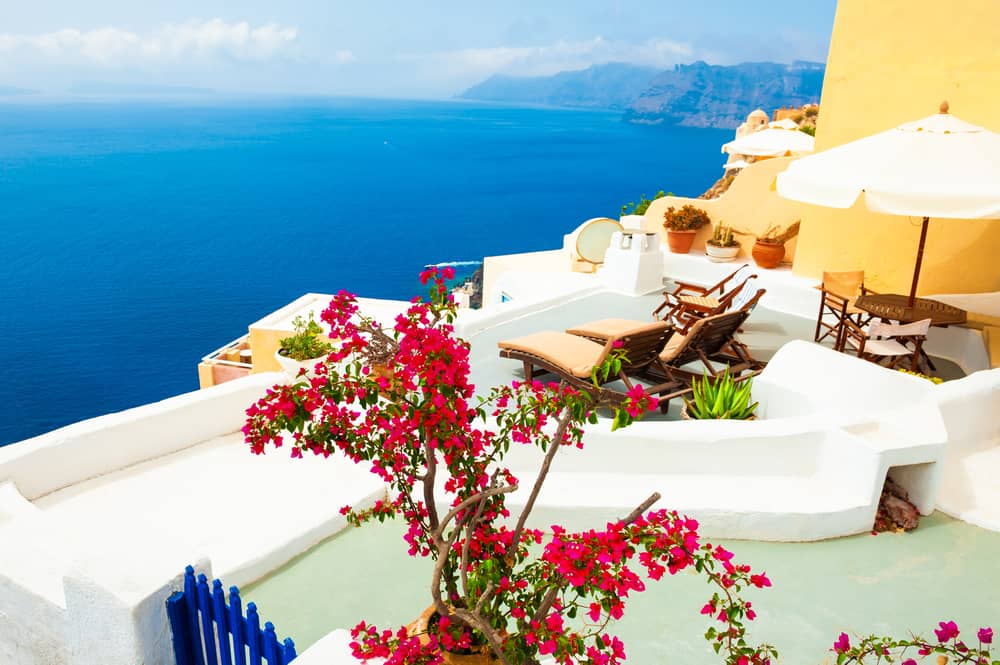 White architecture and blue sea on Santorini island, Greece. Beautiful terrace with sea view. 