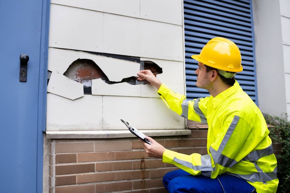 Real Estate Property Appraisal. Man Inspecting House