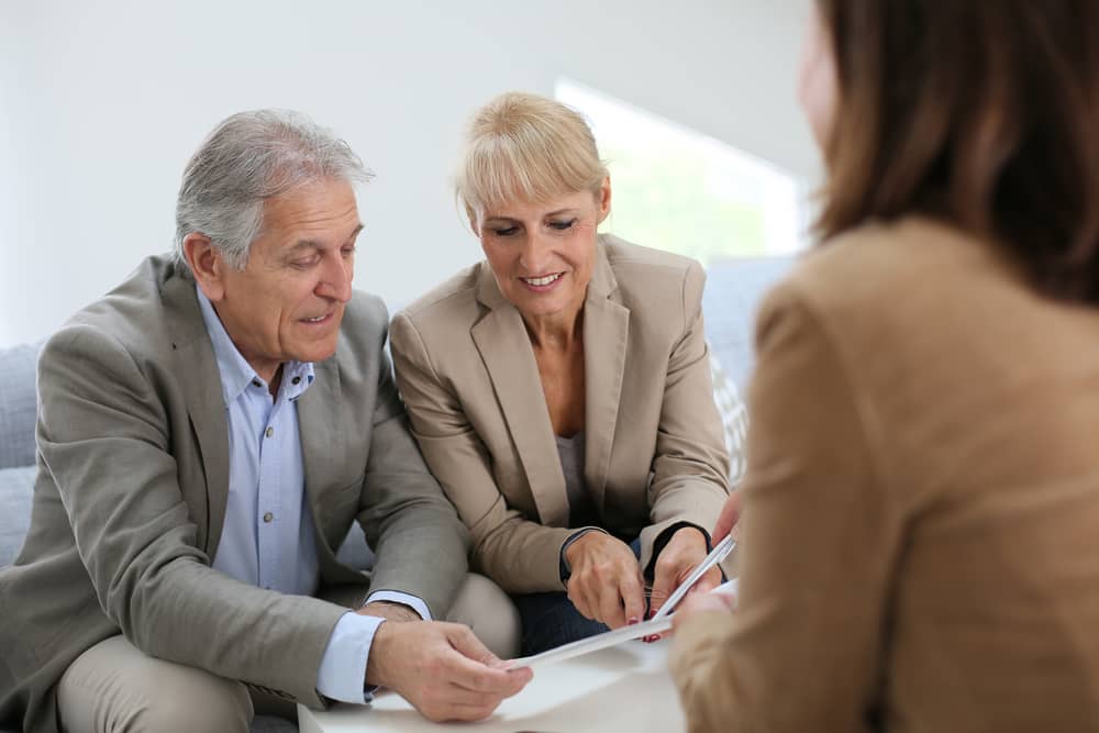 Senior couple meeting real estate agent