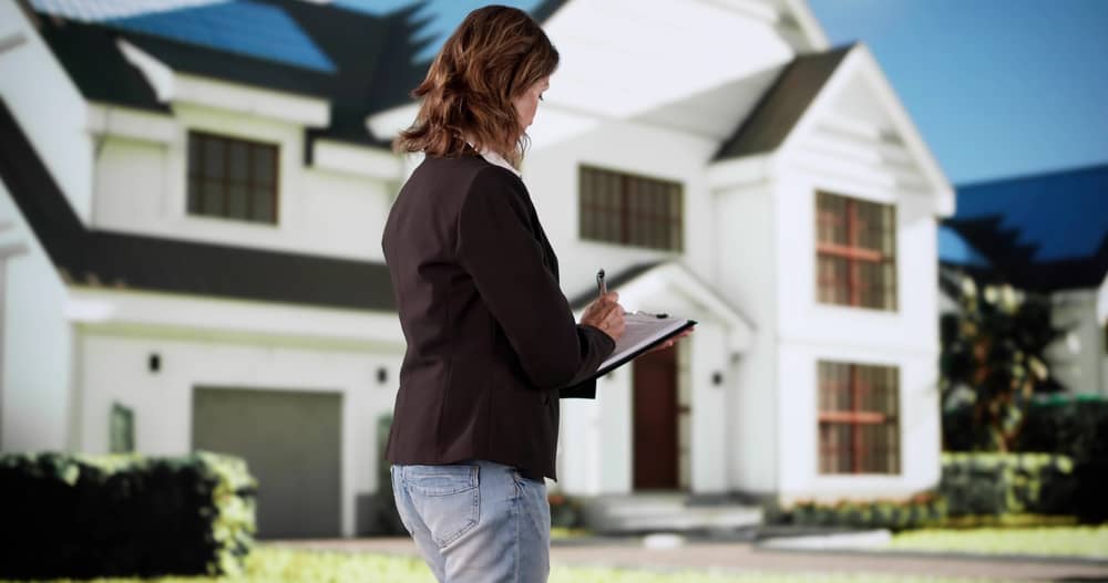 Professional Real Estate Agent Conducts House Appraisal And Property Inspection.