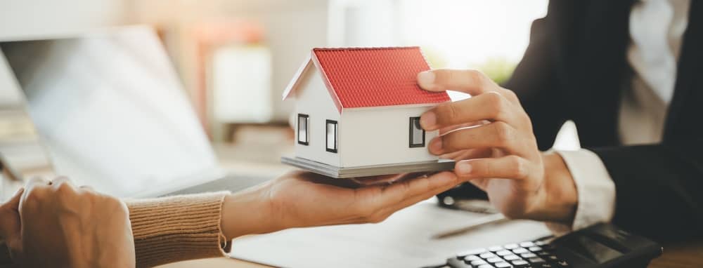 Hand of landlord, realtor pointing sign signature contract rental, purchase, buyer home or apartment with tenant, client after banker agreement mortgage, loan success or done. Property agent concept.