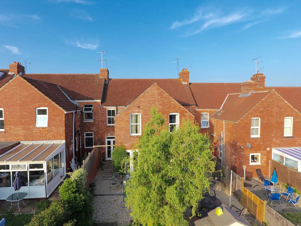 Aerial view of terraced British housing development 
